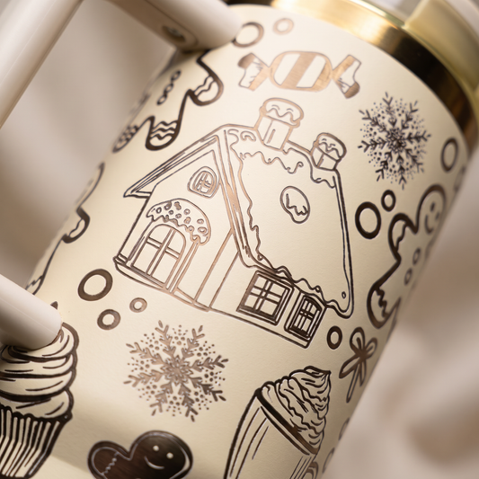 40oz Gingerbread tumbler - close-up of laser engraved gingerbread house and snowflakes