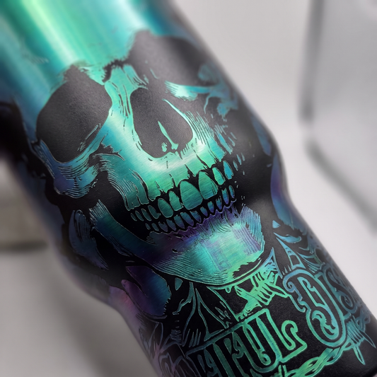 40oz Beautiful Disaster tumbler - close-up of laser engraved holographic skull detail
