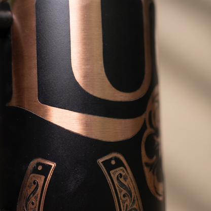 40oz Lucky Shamrock tumbler - close-up of laser engraved four-leaf clover and checkerboard detail