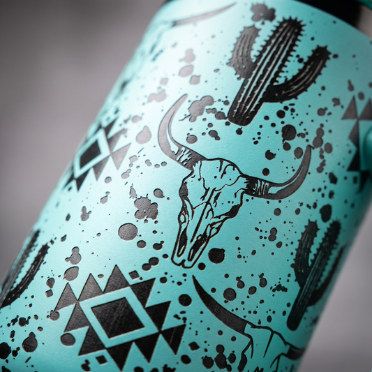 Laser engraved western skull and cactus 40oz tumbler - studio macro shot