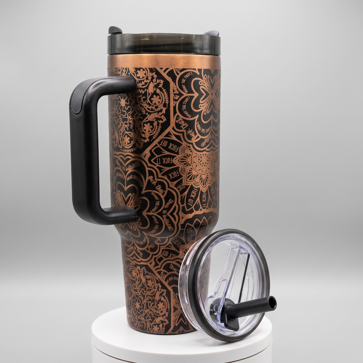 Laser engraved mandala pattern 40oz tumbler with bold lettering - studio angle shot