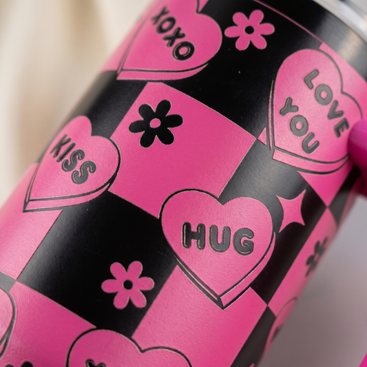 40oz Love Notes tumbler - close-up of laser engraved candy heart pattern