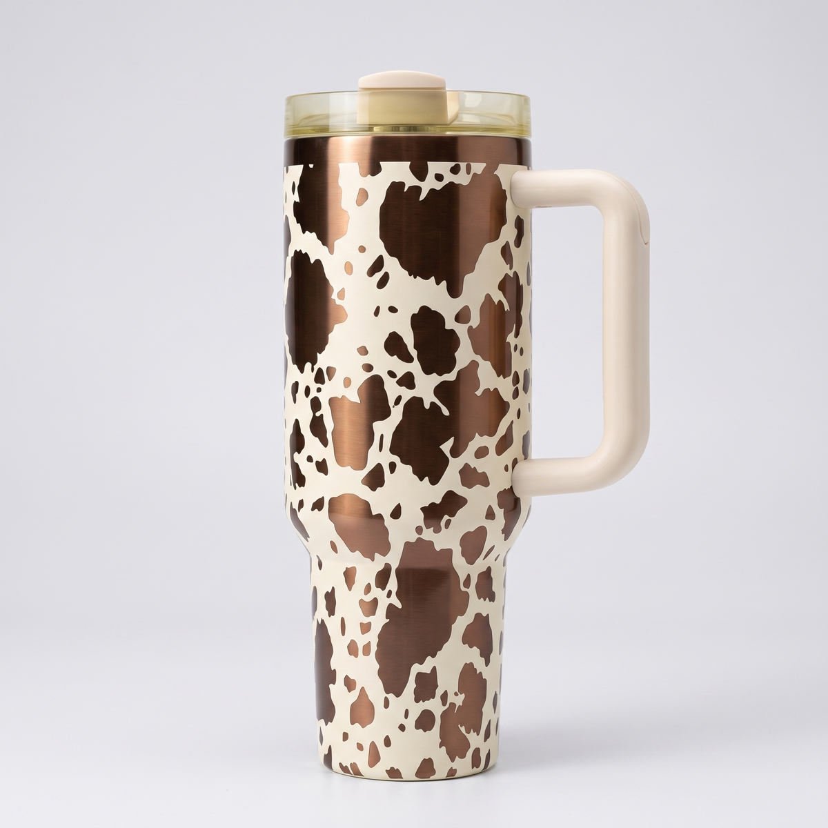40oz Cow Print tumbler - laser engraved black and white cow print design, studio hero shot