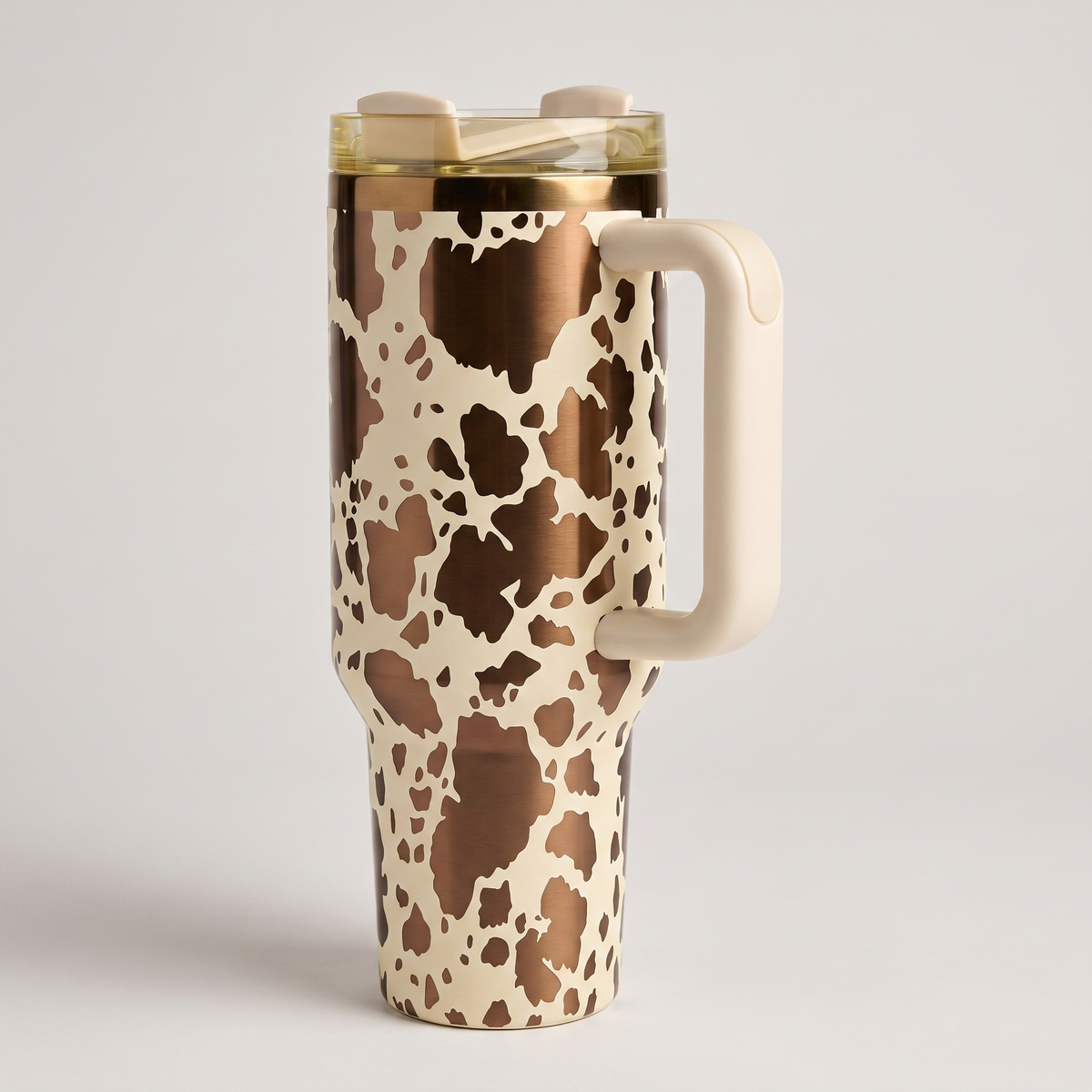 40oz Cow Print tumbler with handle - studio angle shot