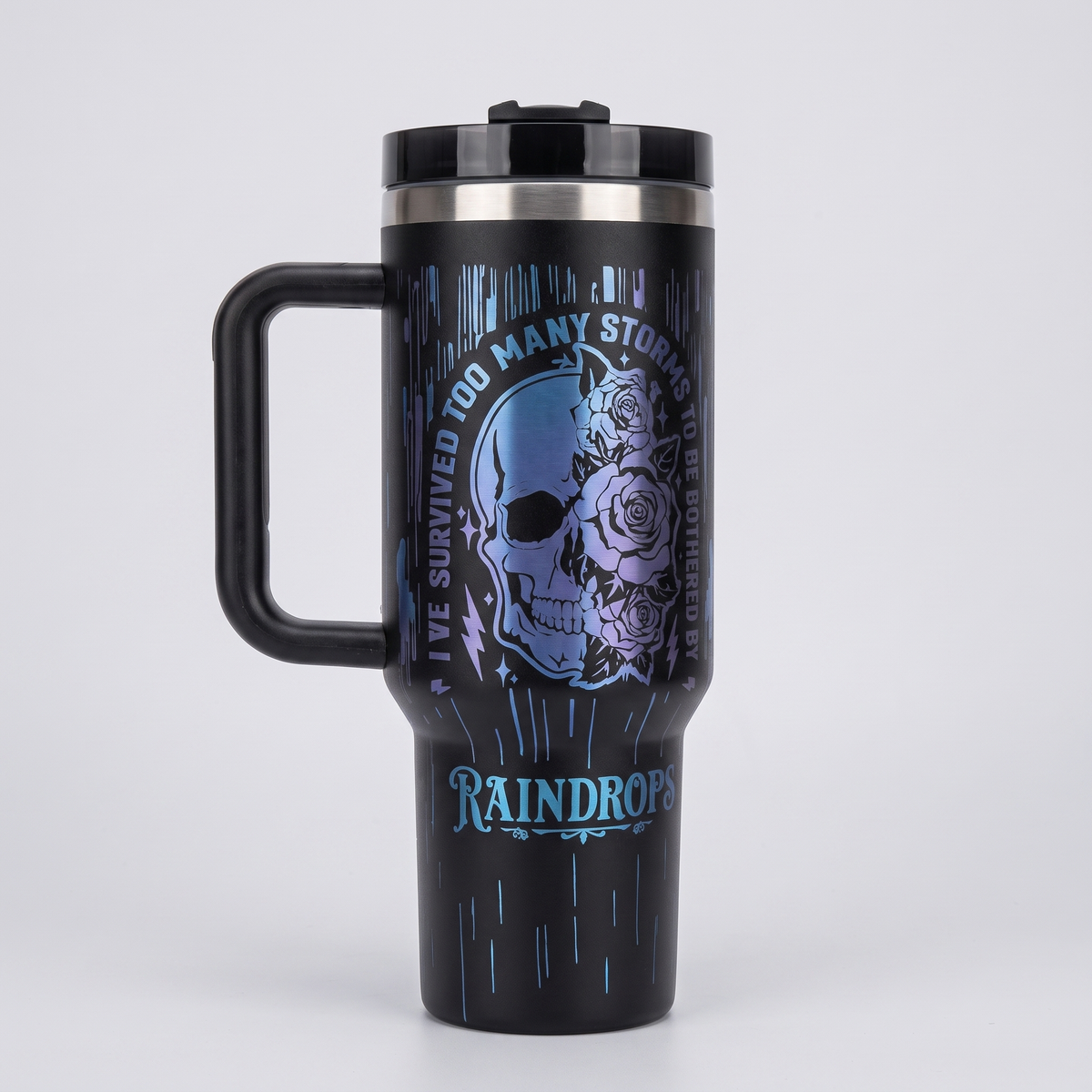 40oz Survived Storms tumbler - laser engraved half-skull half-floral design, studio hero shot