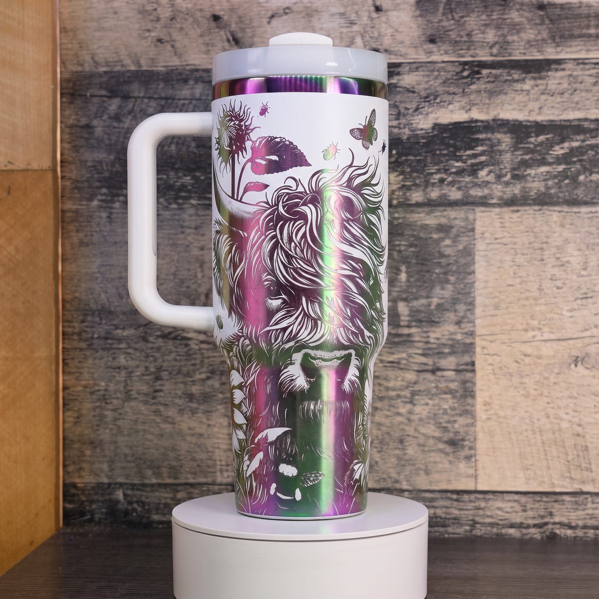 40oz Highland Cow and Sunflowers tumbler - laser engraved holographic rainbow design, studio hero shot